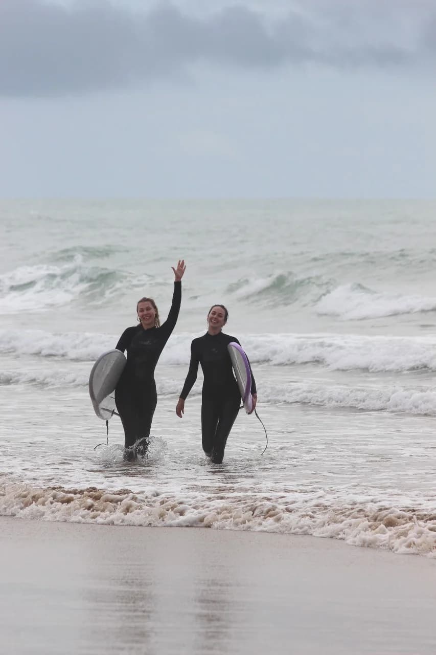 Pearl guests after a morning surf — friends after one week.