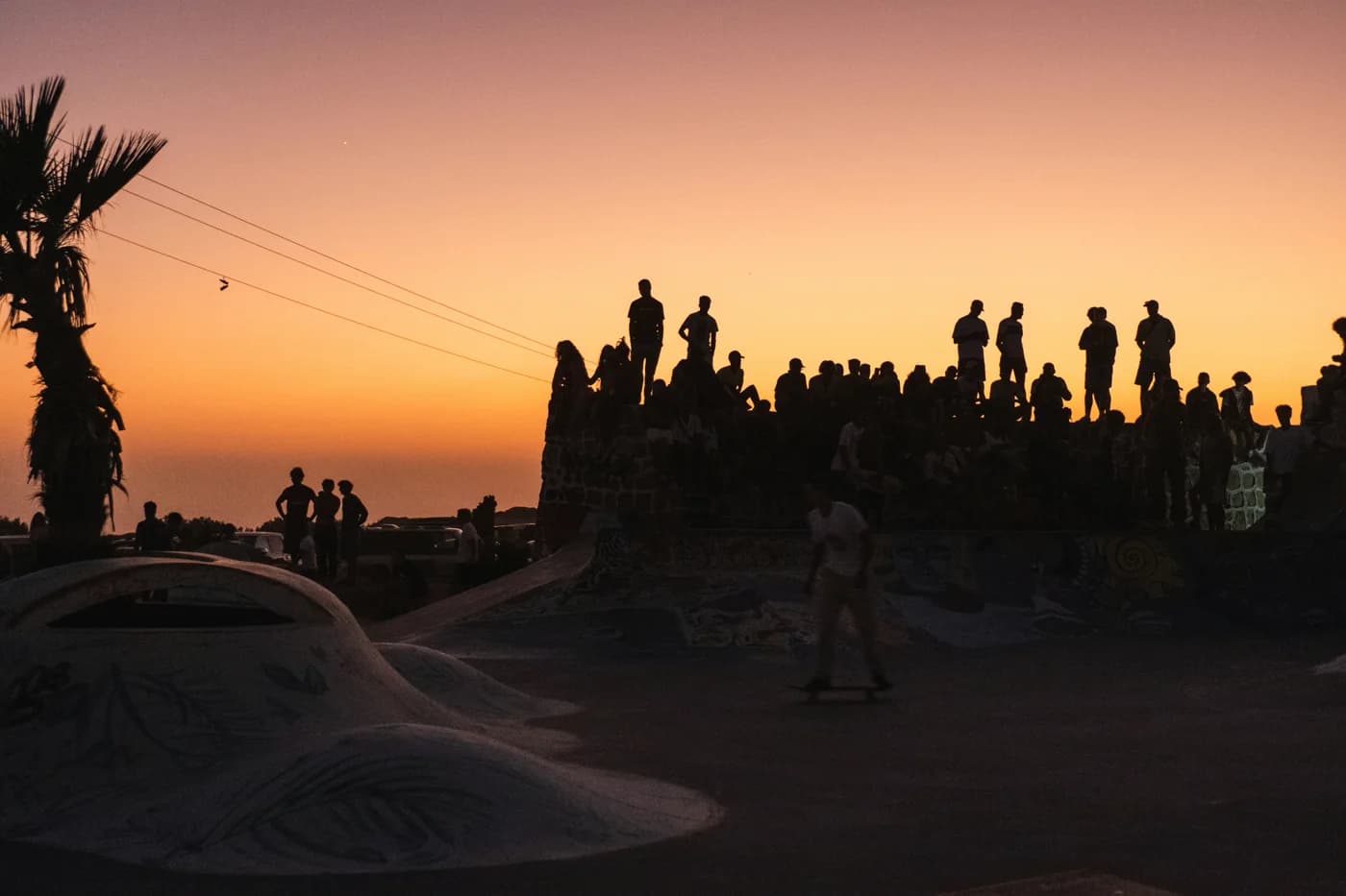 The crew gathered above the bay at sunset.