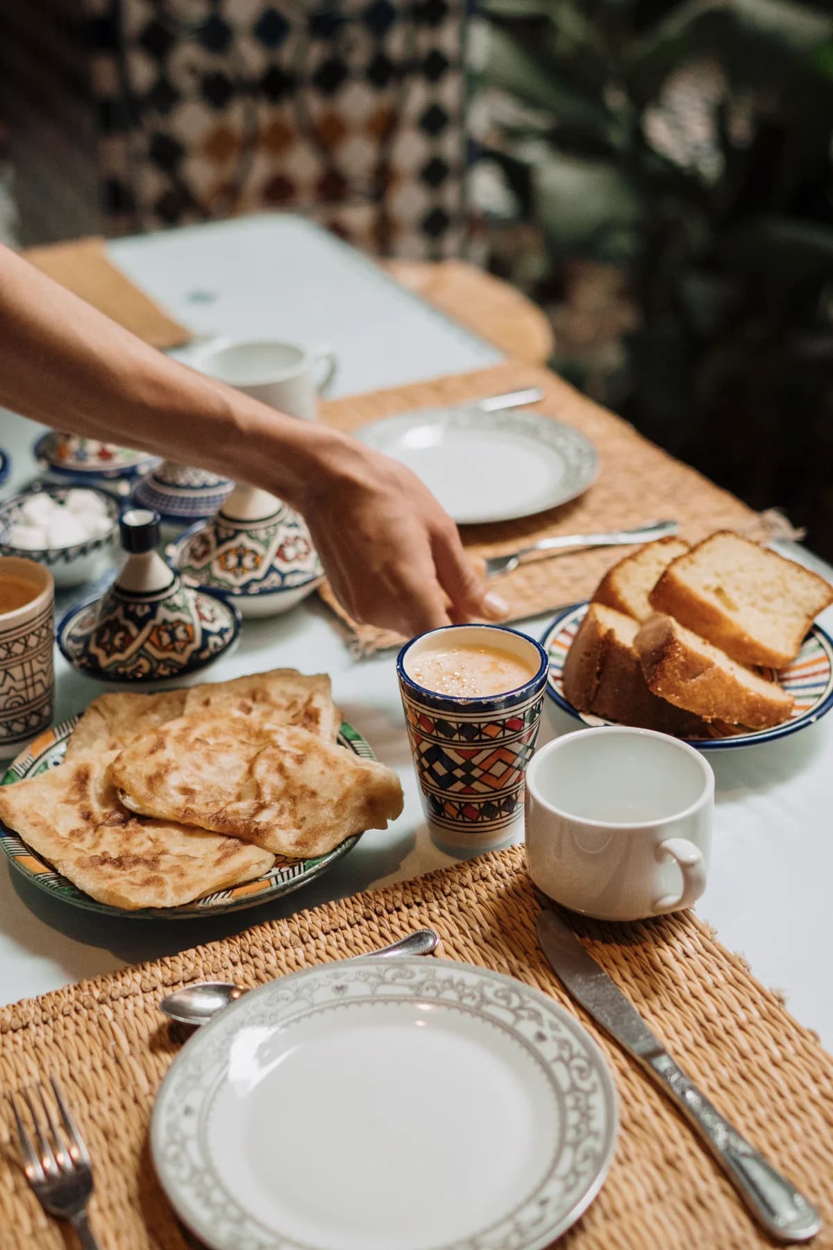 A Moroccan breakfast table, bread, msemen and coffee