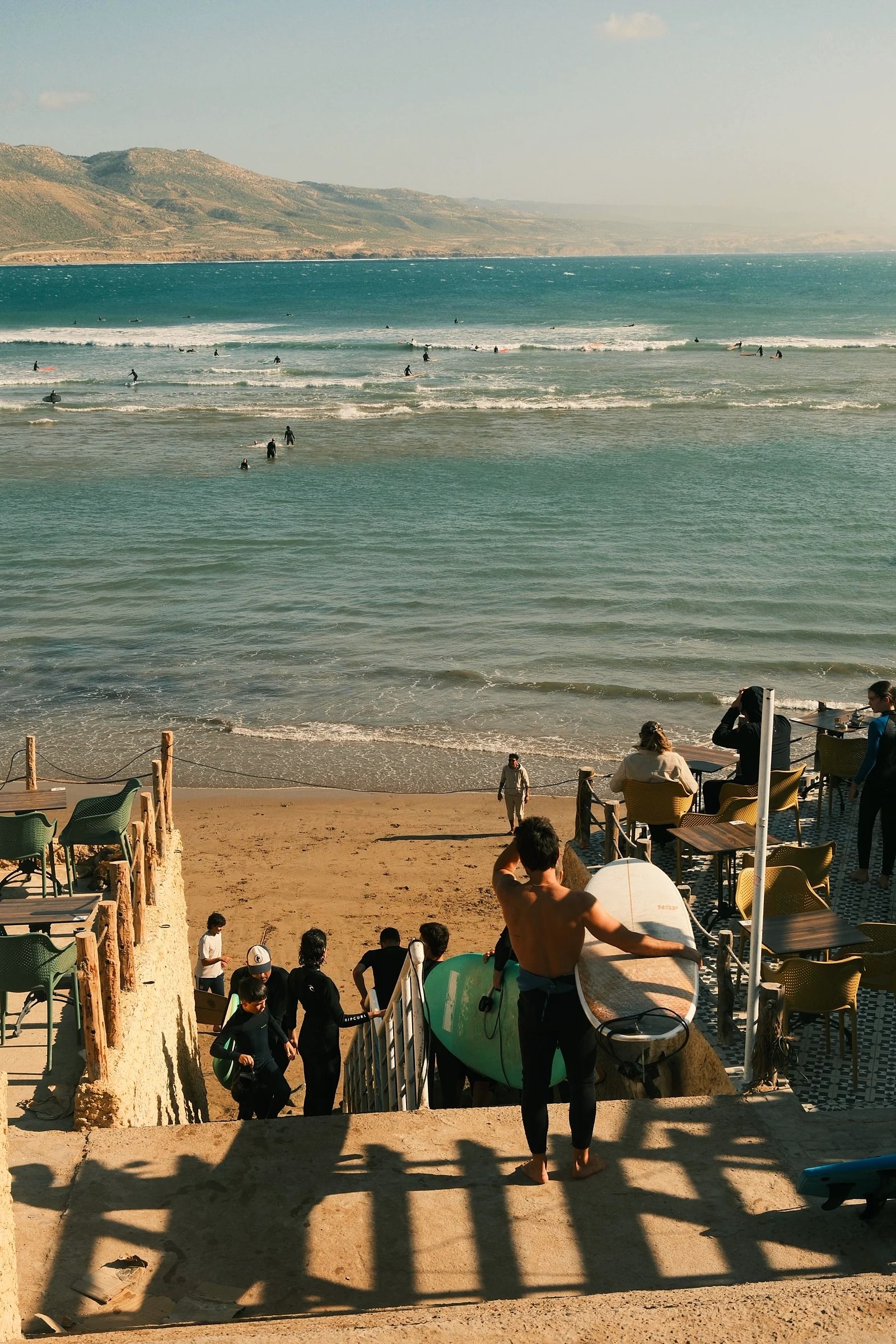 A surfer trimming down the line at golden hour
