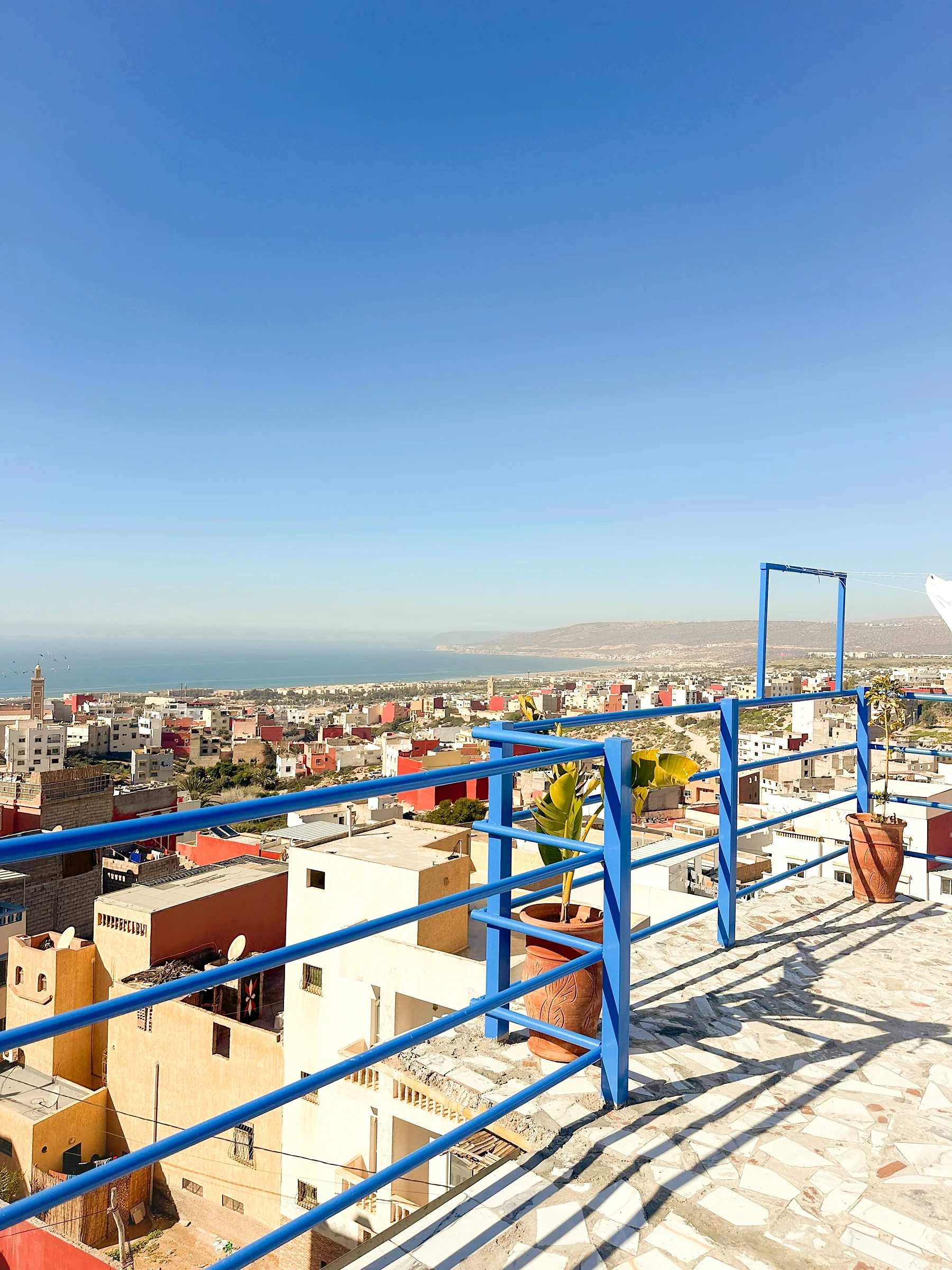 The Blue Pearl rooftop terrace over Taghazout Bay at golden hour