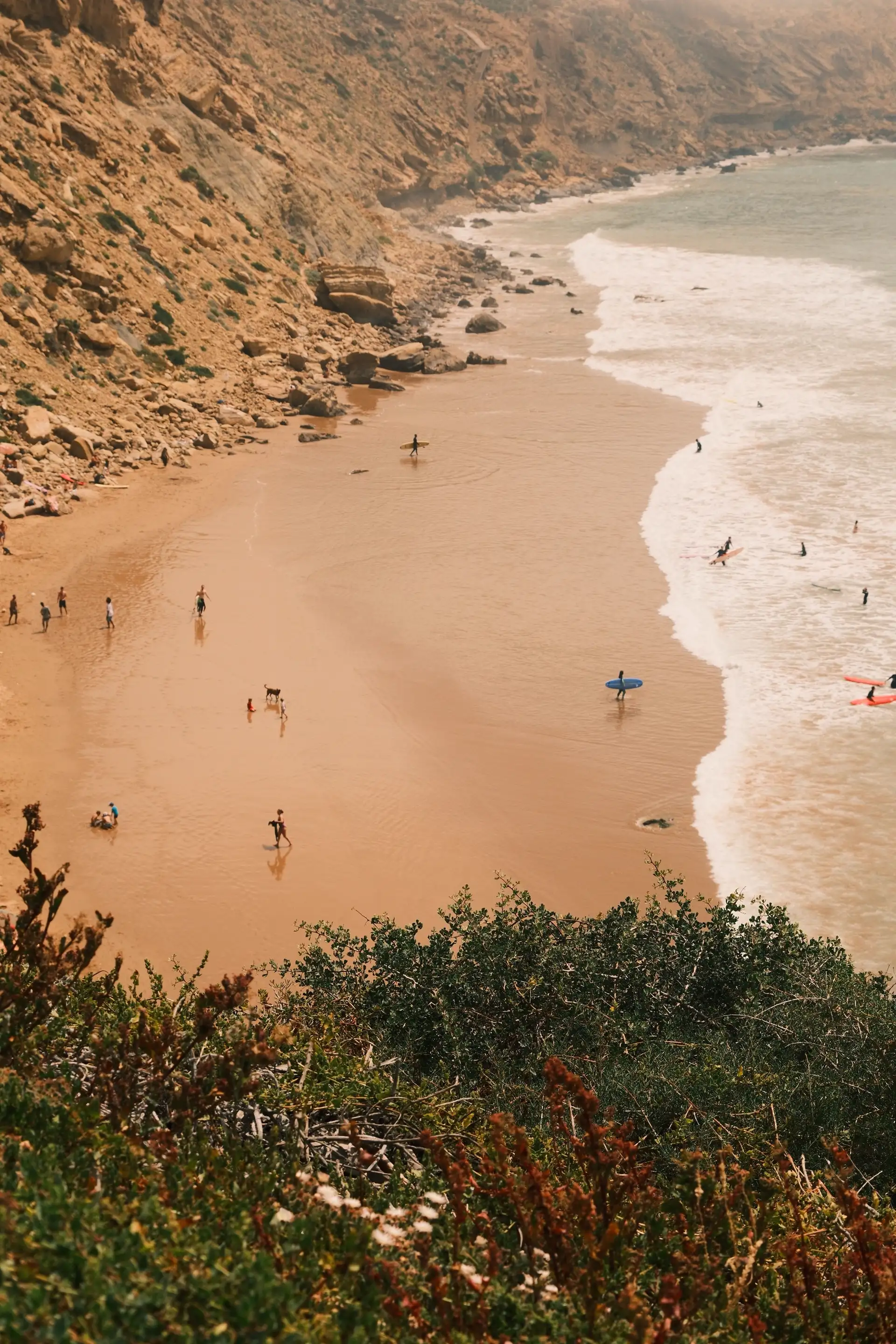 Waves rolling into a golden cove near Taghazout